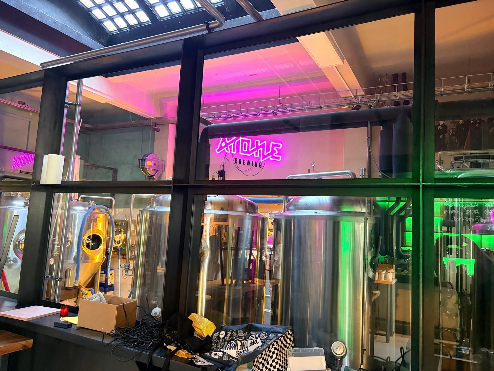 Atone Brewing neon sign inside the brewery